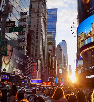 Crowded Times Square at sunset
